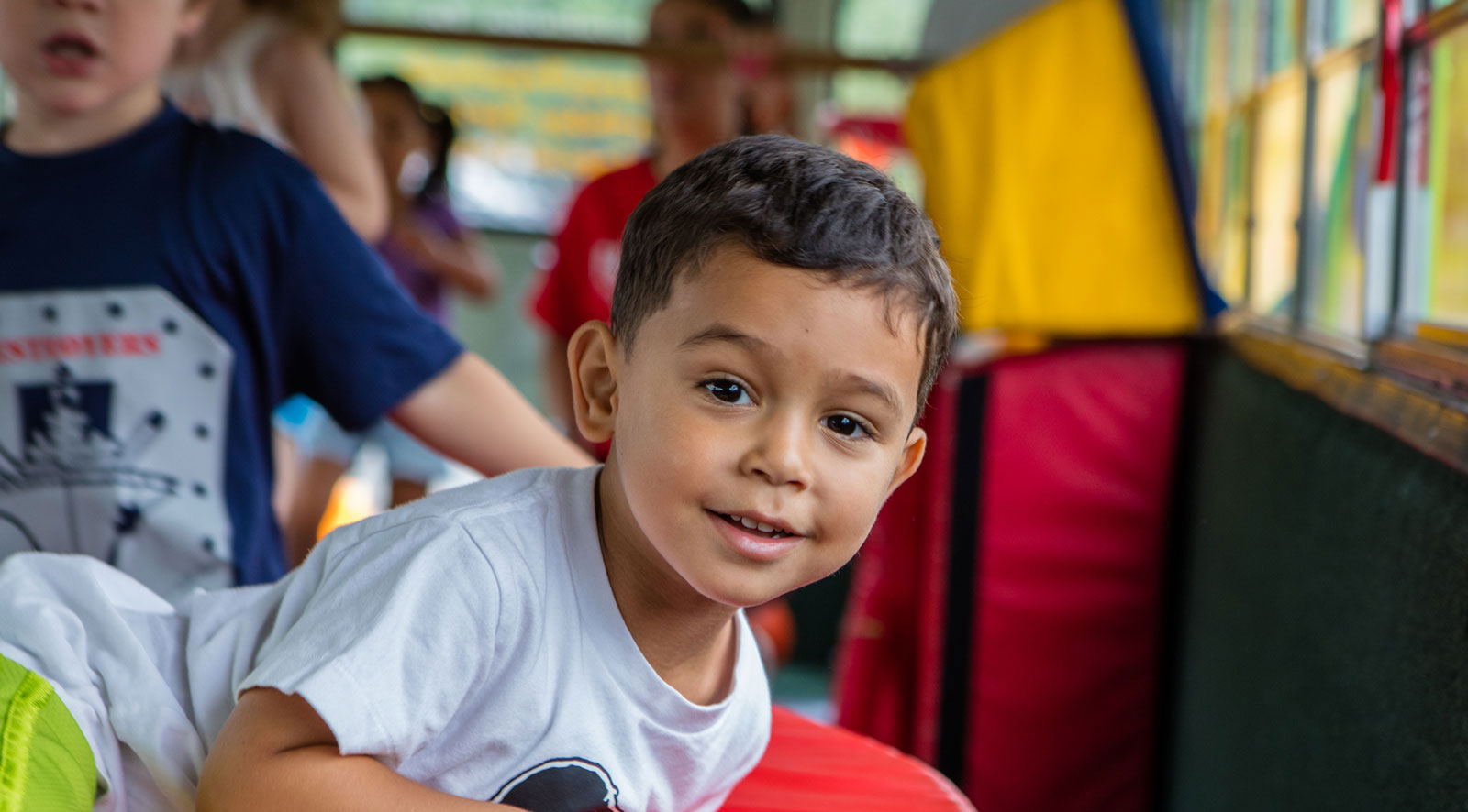 child playing on kids party bus