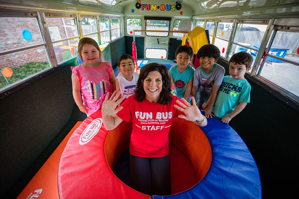 Girl playing at a kid fitness franchise - FUN BUS.