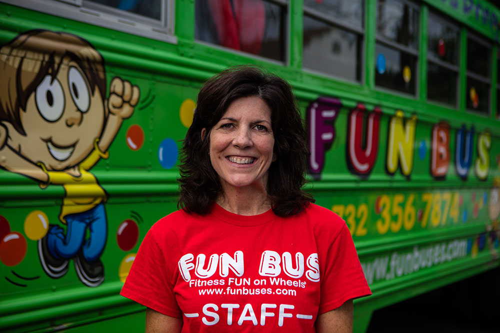 Woman smiling after learning about the advantages of franchising with FUN BUS.