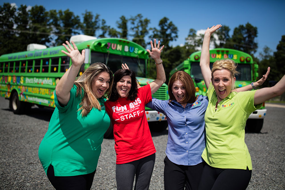 Franchise owners smiling and enjoying their franchise opportunites provided by FUN BUS.