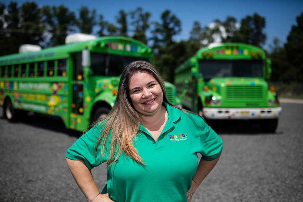 There are endless benefits of franchising with FUN BUS - like these cute kids and their excitement seeing the bright green bus!