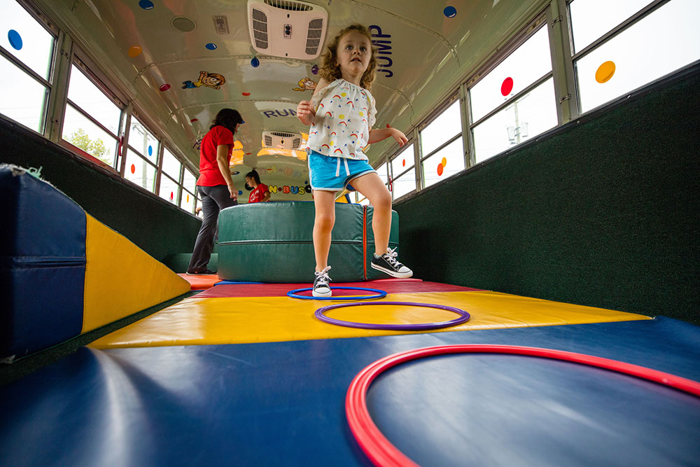 Child playing at an indoor playground franchise