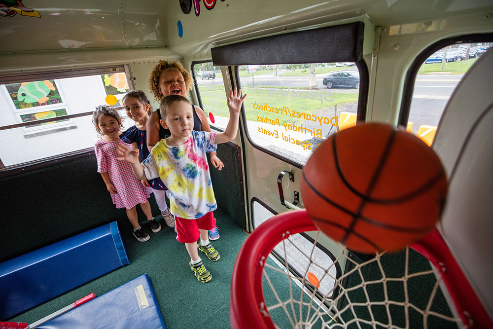 Kids playing basketball at a kids gym franchise