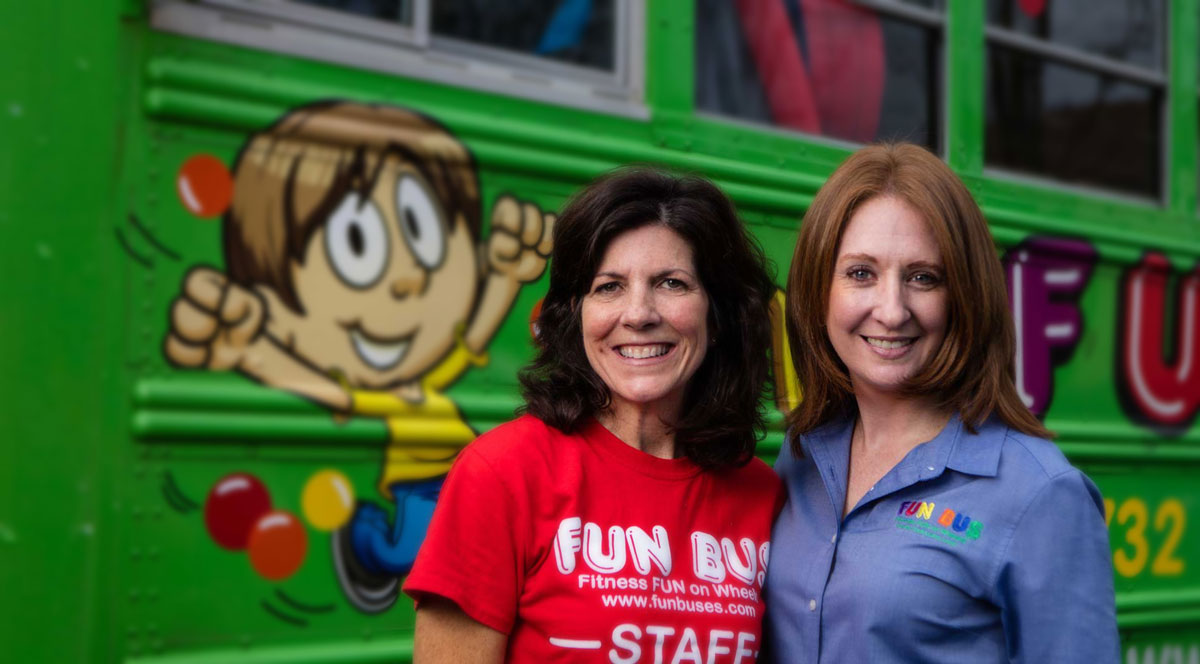 staff in front of kids party bus Orange County