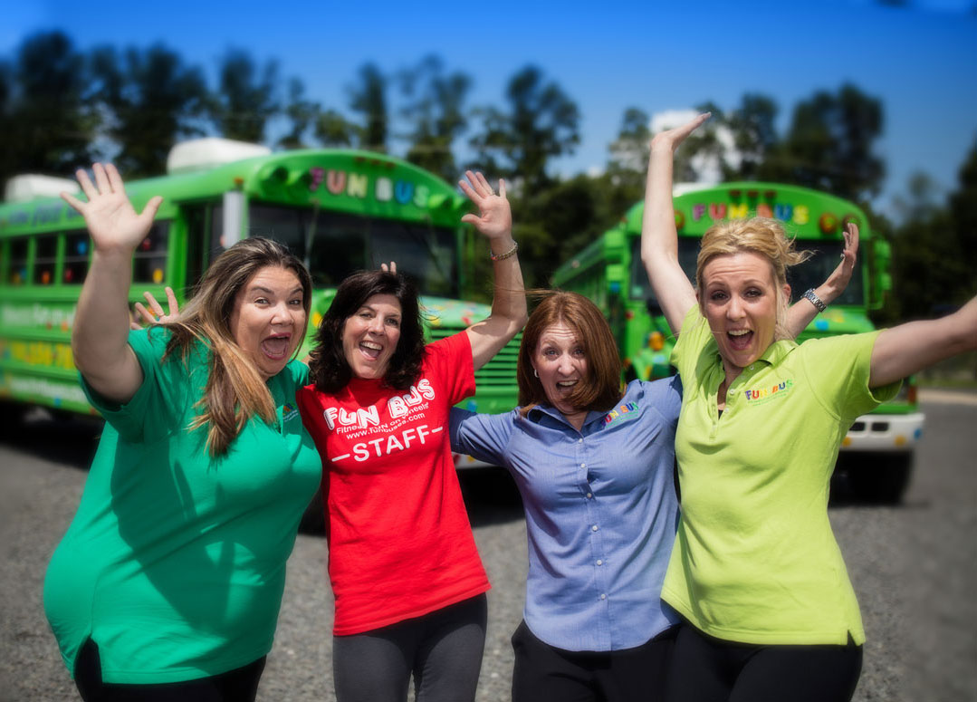 staff in front of kids party bus Somerset